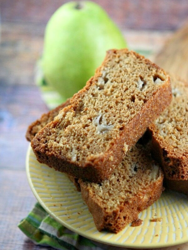 slices of pear bread with a fresh green pear