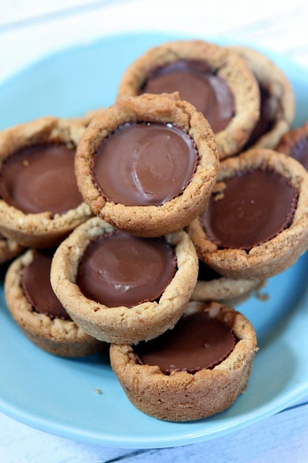 Peanut Butter Cup Cookie Cupcakes  stacked on a blue plate