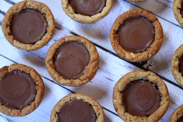 Peanut Butter Cup Cookie Cupcakes on a wooden platter