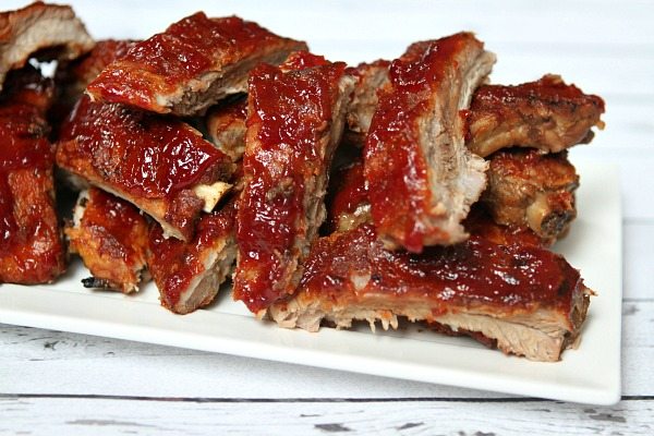 Slow Cooker Sriracha Cranberry Baby Back Ribs recipe from RecipeGirl.com Slow Cooker Sriracha- Cranberry Baby Back Ribs on white platter