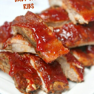pinterest image for slow cooker sriracha cranberry baby back ribs