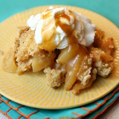 serving of irish apple crisp on yellow plate