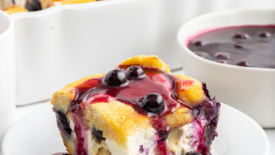 slice of blueberry french toast with sauce on top