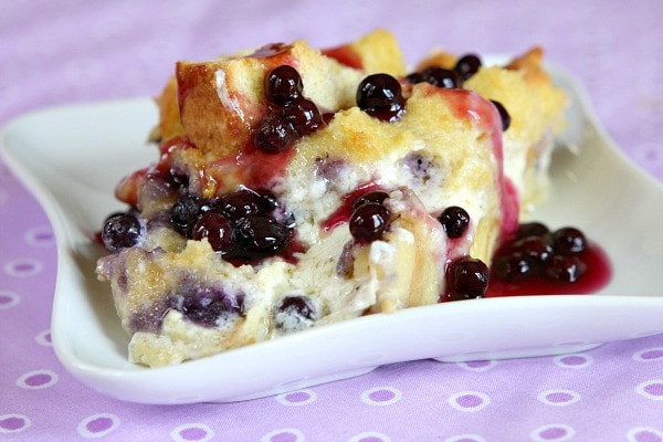 serving of blueberry french toast on a white plate with a purple napkin background
