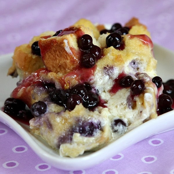 serving of blueberry french toast on a white plate with a purple napkin background