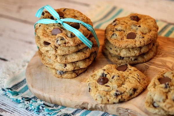 Oatmeal Chocolate Chip cookies on a board with ribbon