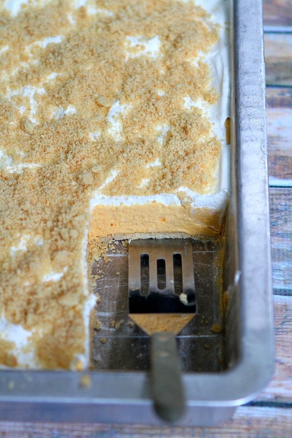 Serving No Bake Pumpkin Shortbread Bars with spatula