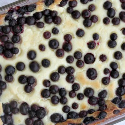 overhead shot of blueberry gooey butter cake in a 9x13-inch pyrex pan