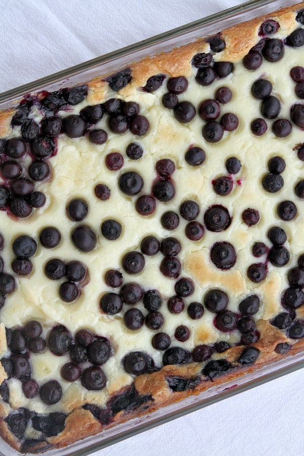 overhead shot of blueberry gooey butter cake in a 9x13-inch pyrex pan