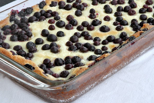 blueberry gooey butter cake in a pyrex pan