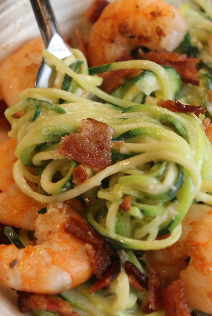 fork of alfredo zoodles with bacon and shrimp