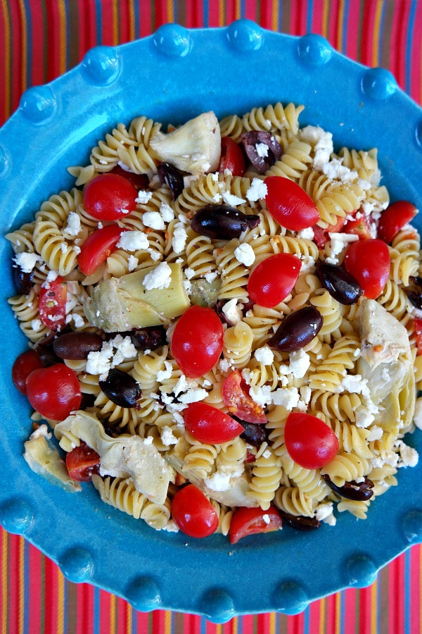 Greek Pasta Salad recipe from RecipeGirl.com Greek Pasta Salad in a blue bowl
