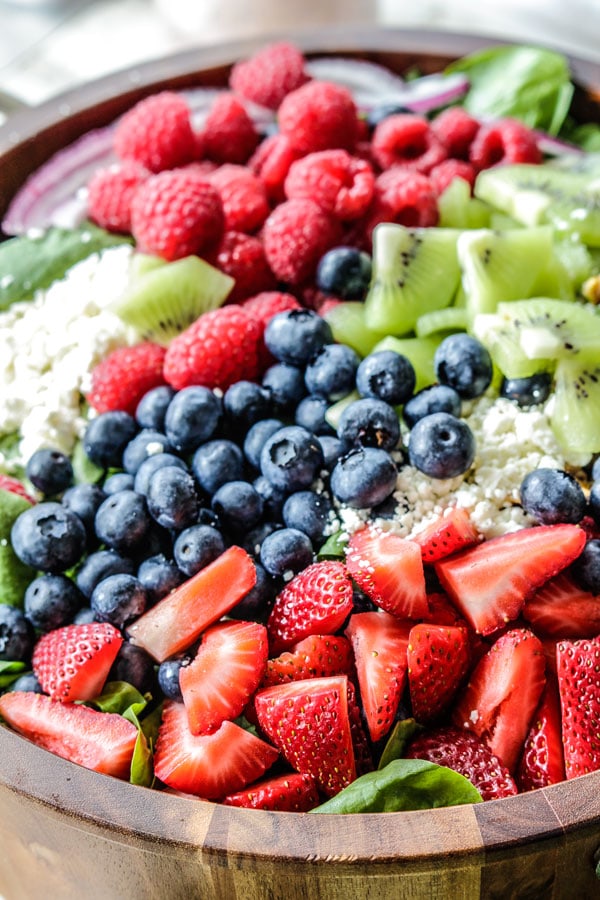 kiwi berry salad in a wooden bowl