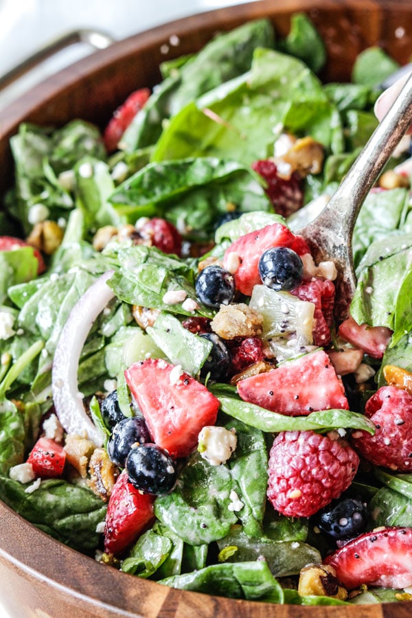 kiwi berry green salad in a wooden bowl