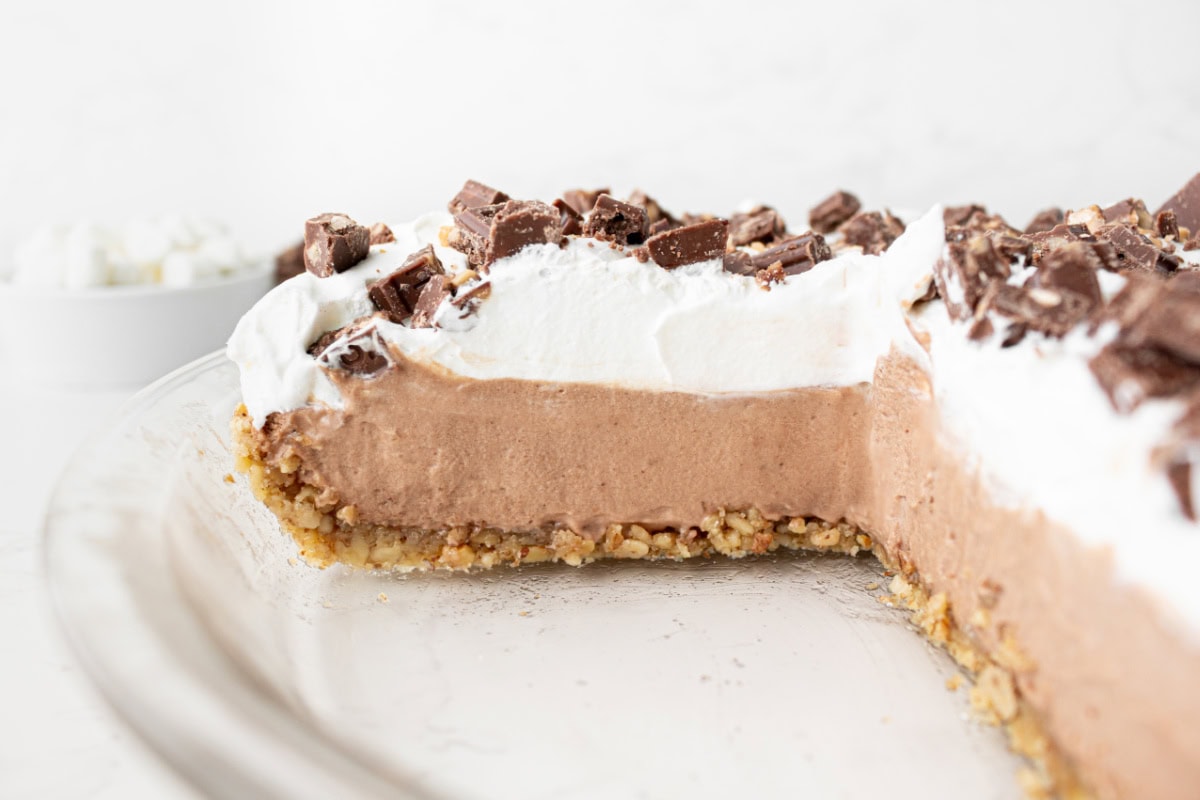 candy bar pie with big slice taken out of it