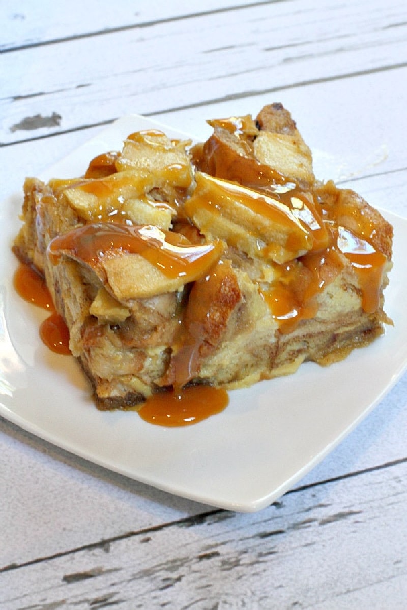 slice of caramel apple bagel bread pudding on white plate