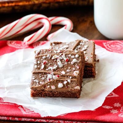 Easy, moist, chocolaty Peppermint Texas Sheet Cake smothered in peppermint infused chocolate frosting is the perfect, easy holiday dessert for you neighbors, friends and family!