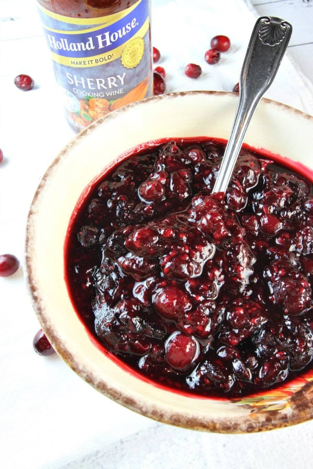 Sweet, tart, and full of flavor — this Sherry Triple Berry Cranberry Sauce combines cranberries, blueberries, and raspberries with a splash of sherry for the ultimate holiday side. bowl of sherry triple berry cranberry sauce