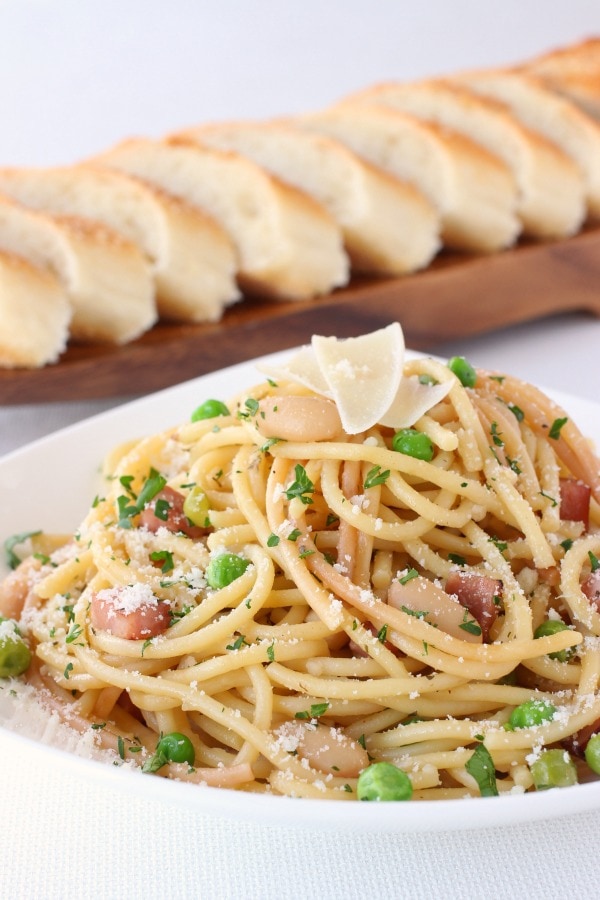 Ham and Bean Skillet Spaghetti recipe from RecipeGirl.com Ham and Bean Skillet Spaghetti on dish with bread in background