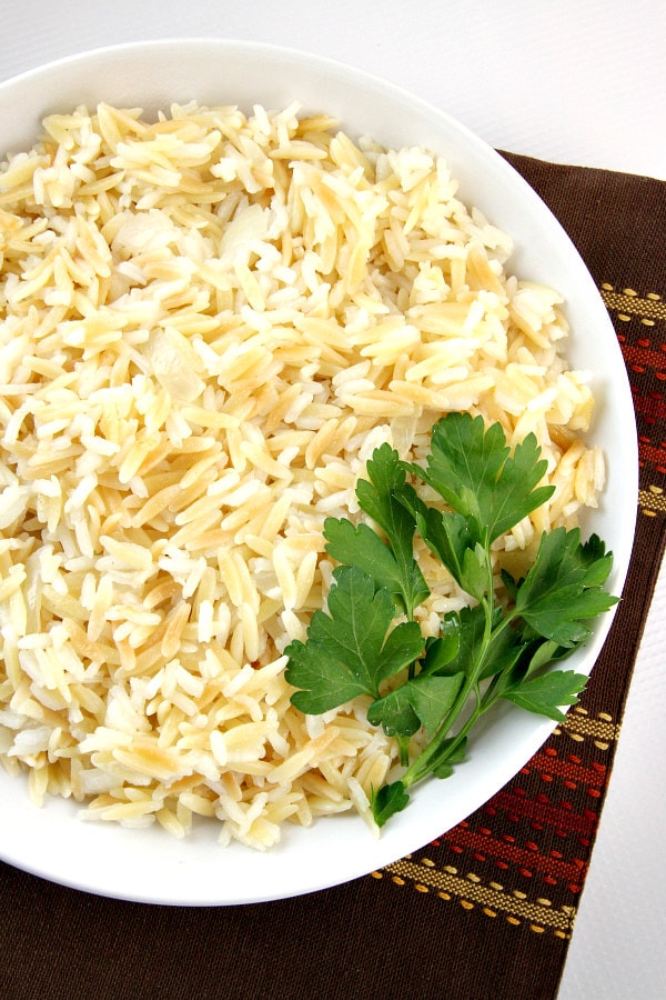 Classic Rice Pilaf Recipe garnished with fresh parsley