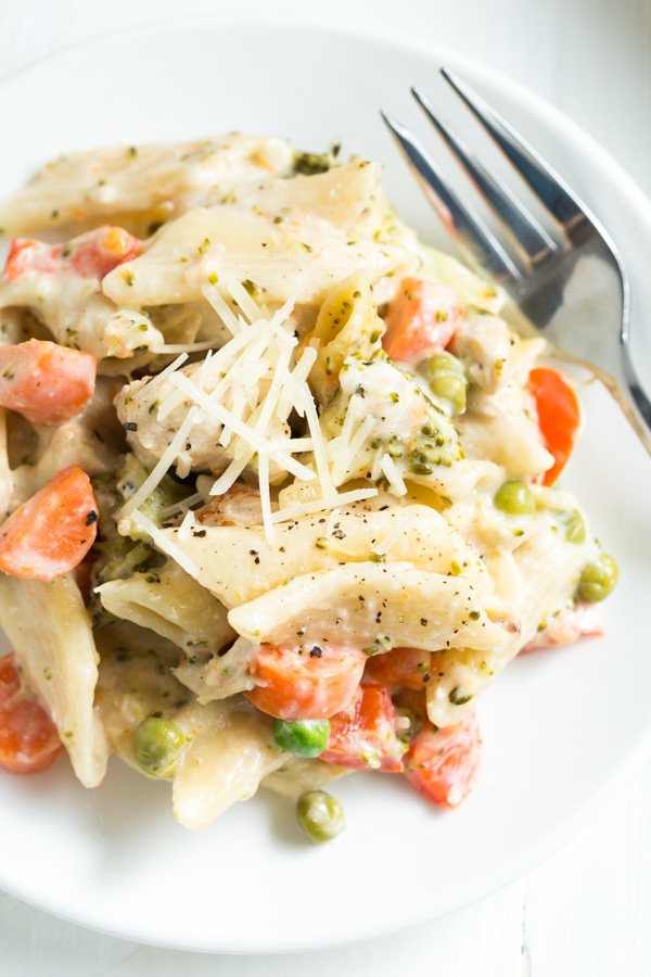 One Pot Creamy Chicken and Vegetable Pasta recipe from RecipeGirl.com #one #pot #onepot #creamy #chicken #vegetable #pasta #dinner #recipe #RecipeGirl One Pot Creamy Chicken and Vegetable Pasta serving on plate