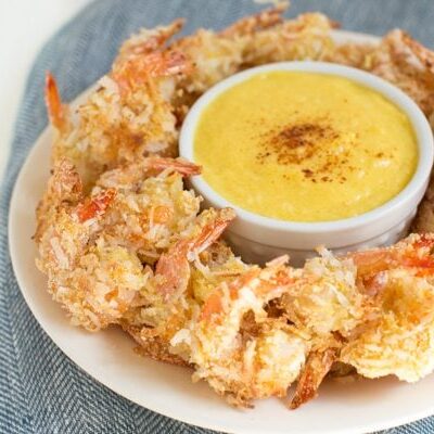 Coconut Shrimp with Mango Coconut Dipping Sauce is a fresh and flavorful appetizer or snack made with coconut flakes, fresh mango and more!