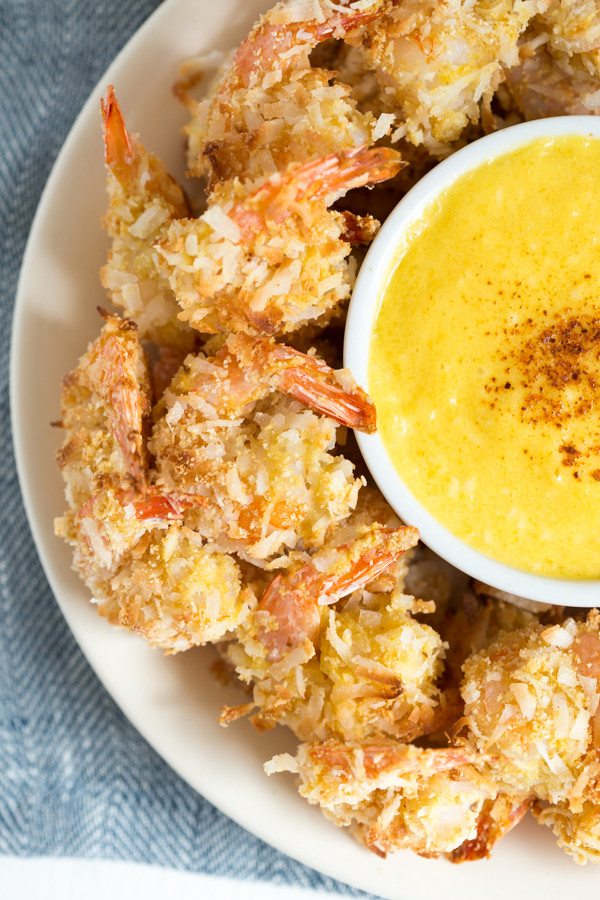 Coconut Shrimp with Mango Coconut Dipping Sauce is a fresh and flavorful appetizer or snack made with coconut flakes, fresh mango and more!