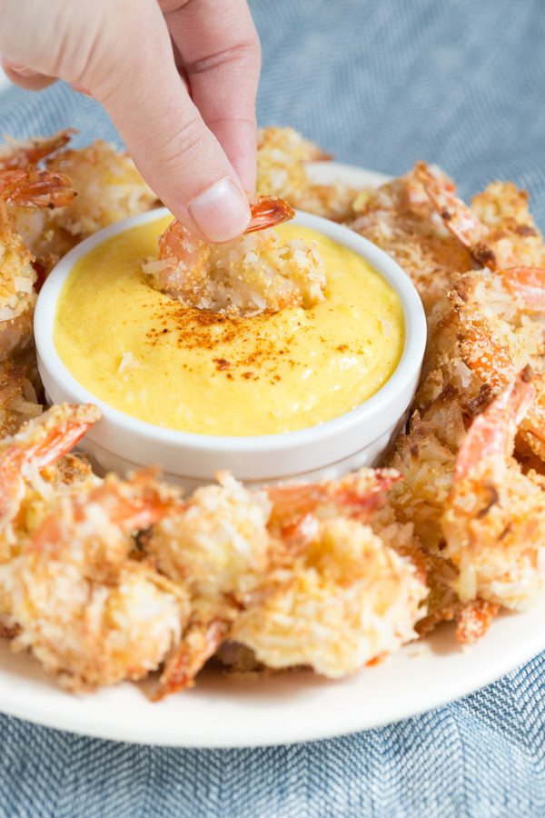 Coconut Shrimp with Mango Coconut Dipping Sauce is a fresh and flavorful appetizer or snack made with coconut flakes, fresh mango and more!