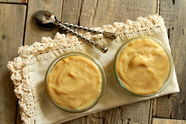 Butterscotch Pudding in two dishes with two spoons on the side