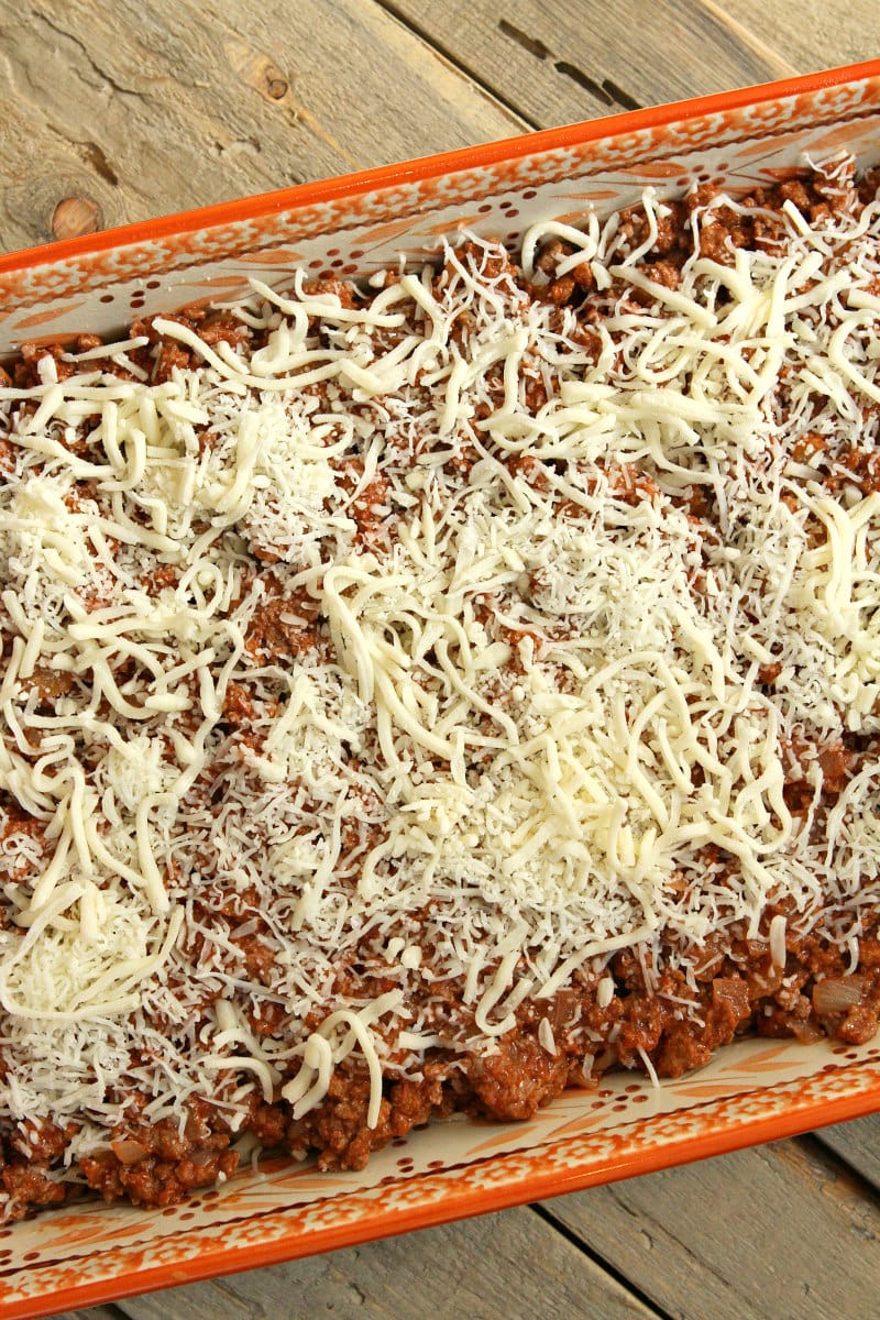 overhead shot of making pastitsio in process looking at the meat and cheese