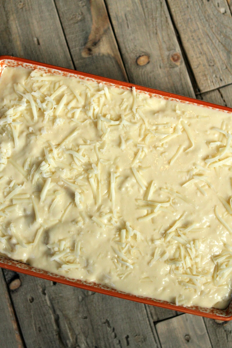 overhead shot of pastitsio in a casserole dish ready to go in the oven