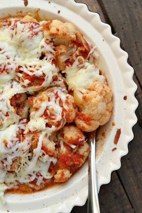 serving Cauliflower Pizza Casserole out of a pie plate