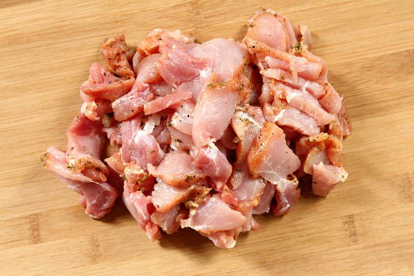 chopped and seasoned pork on a cutting board