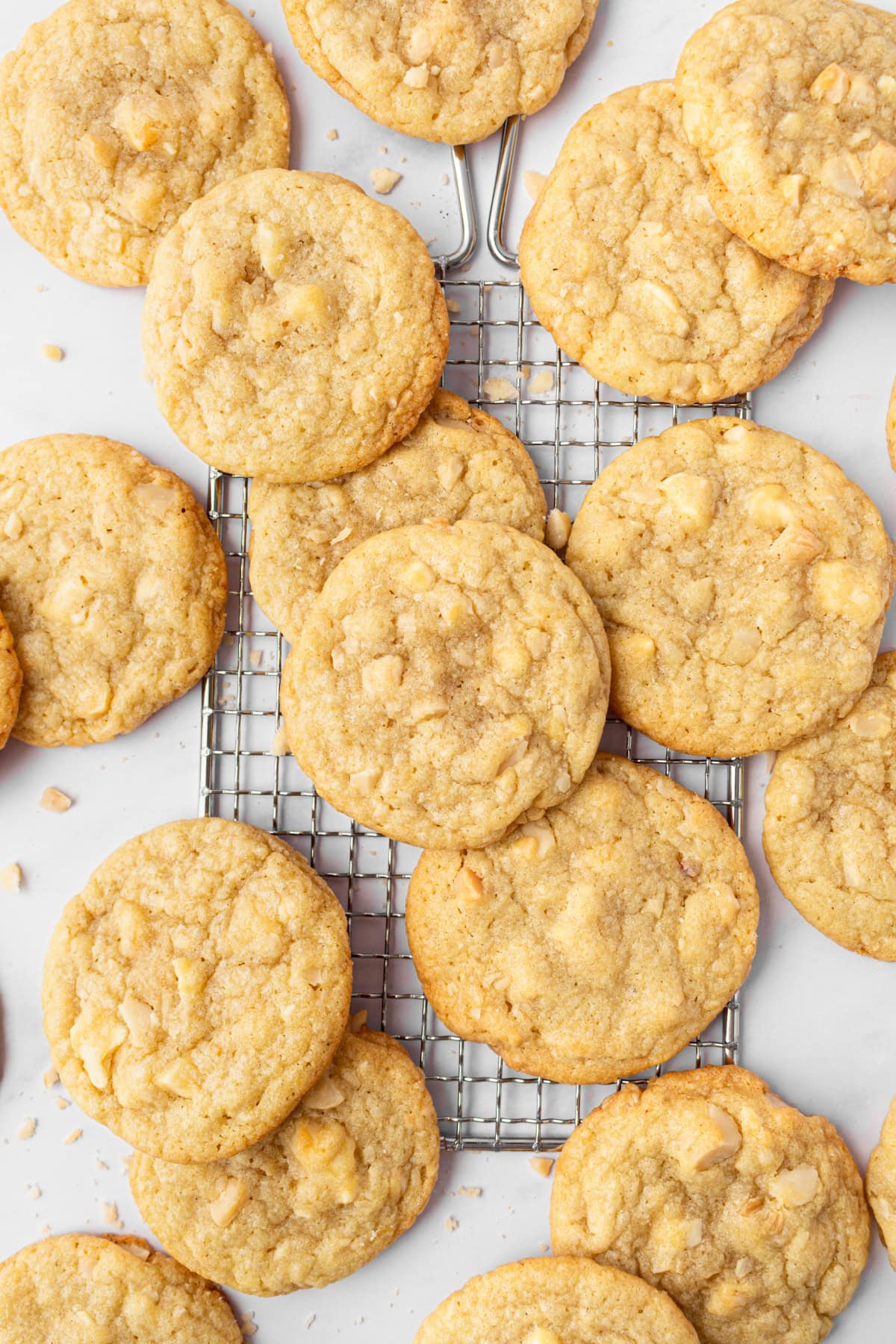 White Chocolate Macadamia Nut Cookies recipe from RecipeGirl.com : perfect classic cookie recipe made famous by Mrs. Fields! white chocolate macadamia nut cookies on cooling rack