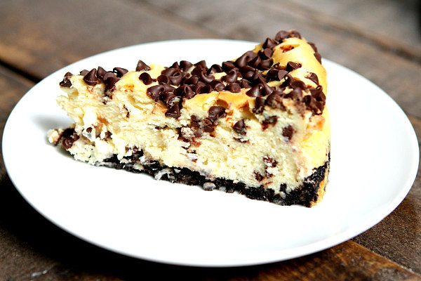 Chocolate Chip Cheesecake recipe from RecipeGirl.com #chocolate #chip #chocolatechip #cheesecake #recipe #RecipeGirl Slice of Chocolate Chip Cheesecake