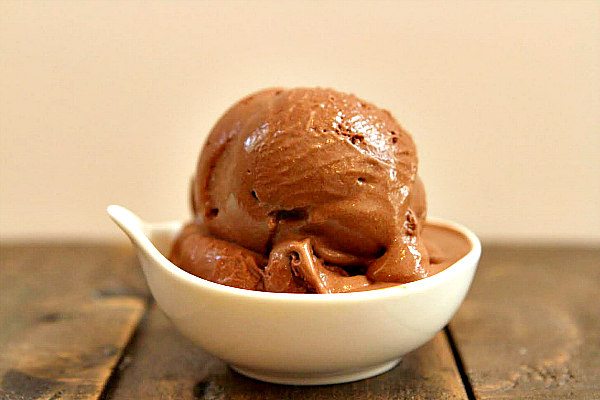 Scoop of Chocolate Espresso Gelato in a white dish on a wooden table