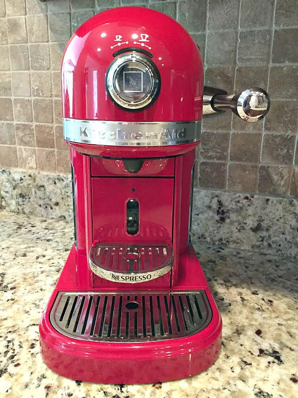 Red KitchenAid Nespresso Machine sitting on a kitchen counter
