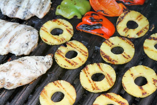 Grilling chicken and pineapple and bell peppers