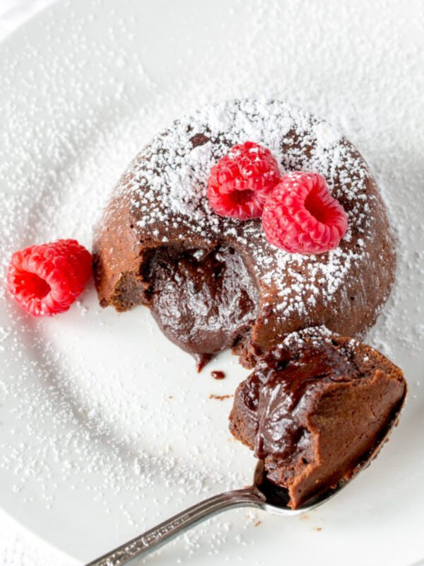 molten chocolate cake broken open to see the gooey inside