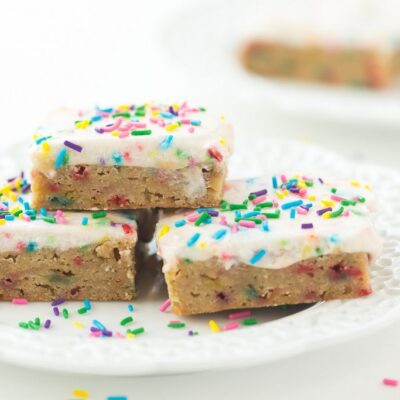 These Funfetti Frosted Blondies are dense, chewy and full of sprinkles! They're perfect for kids lunch boxes or a simple celebration!