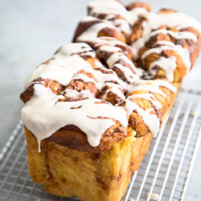 loaf of pumpkin pull apart bread on cooling rack