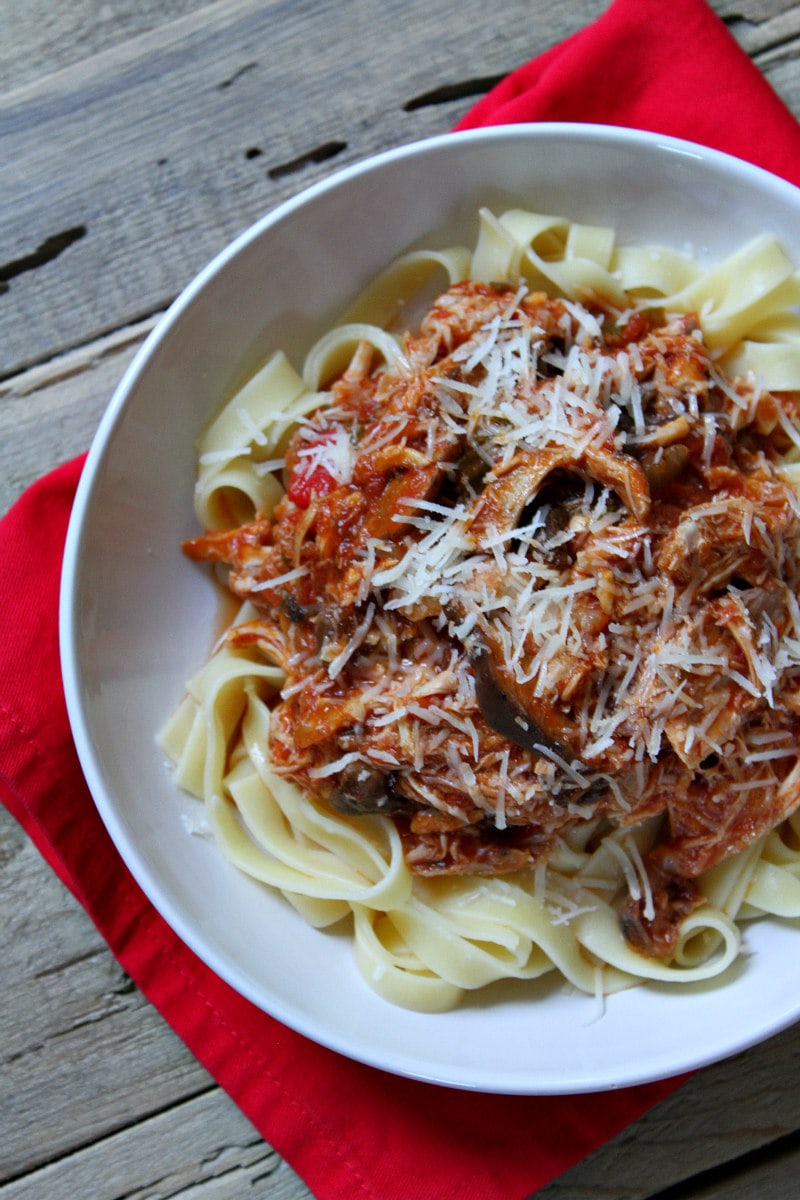 Slow Cooker Chicken Cacciatore served over noodles