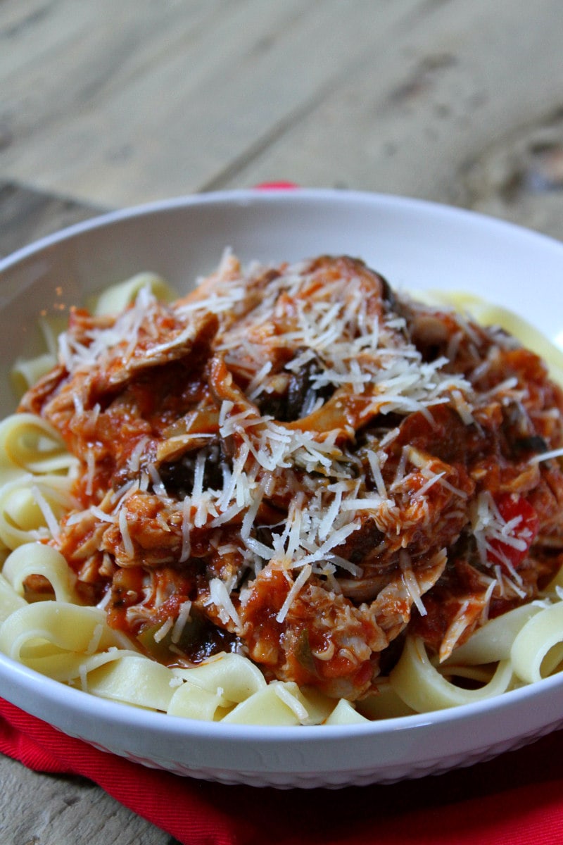 Slow Cooker Chicken Cacciatore served over noodles