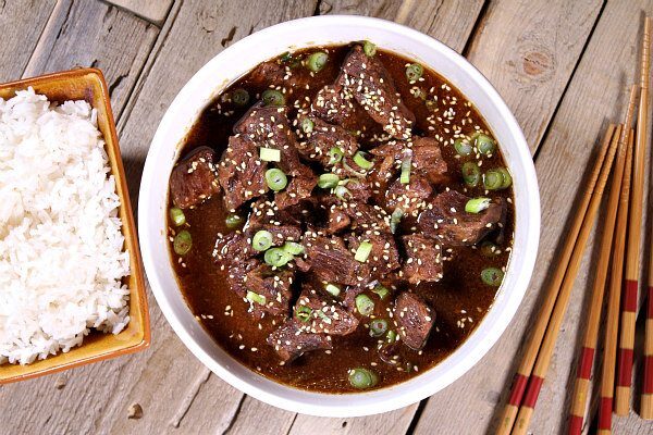 Easy Slow Cooker Korean Beef recipe served over hot steamed rice - great family dinner recipe from RecipeGirl.com