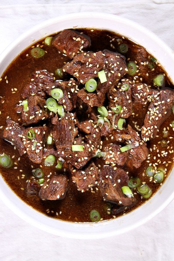 Easy Slow Cooker Korean Beef recipe served over hot steamed rice - great family dinner recipe from RecipeGirl.com