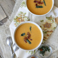 two bowls of sweet potato soup