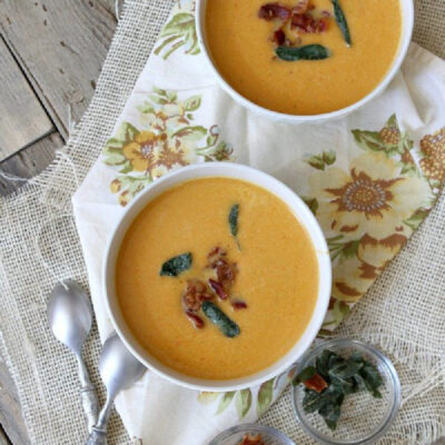 two bowls of sweet potato soup