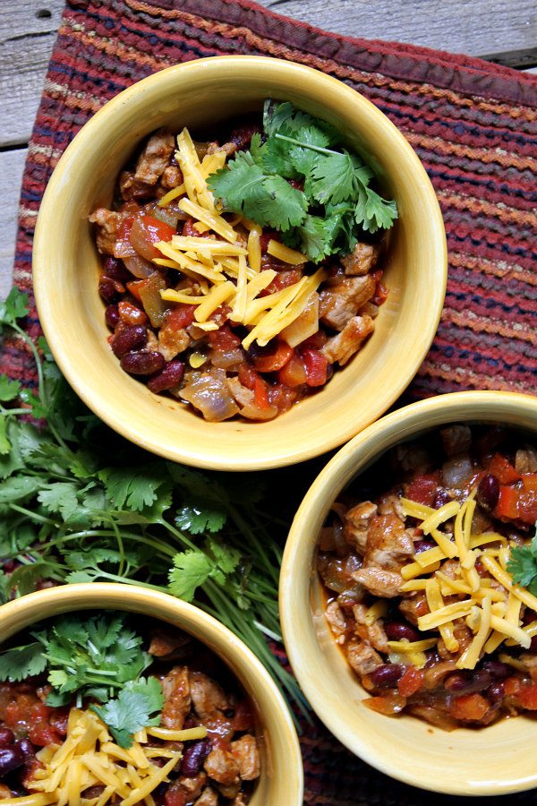 Quick and Easy Pork and Bean Chili recipe - from RecipeGirl.com. I love this recipe so much- chili with a sweet and smoky flavor, perfect comfort food recipe for a chilly day.