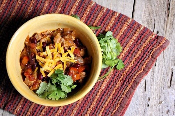Quick and Easy Pork and Bean Chili recipe - from RecipeGirl.com. I love this recipe so much- chili with a sweet and smoky flavor, perfect comfort food recipe for a chilly day.