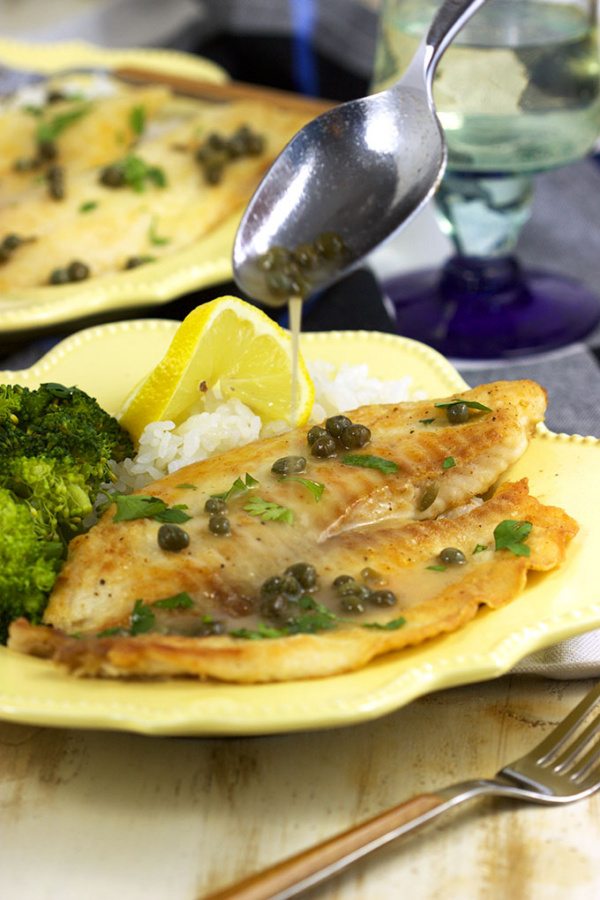 Ready in 10 minutes, this Easy Tilapia Piccata from RecipeGirl.com is a family weeknight favorite dinner recipe.